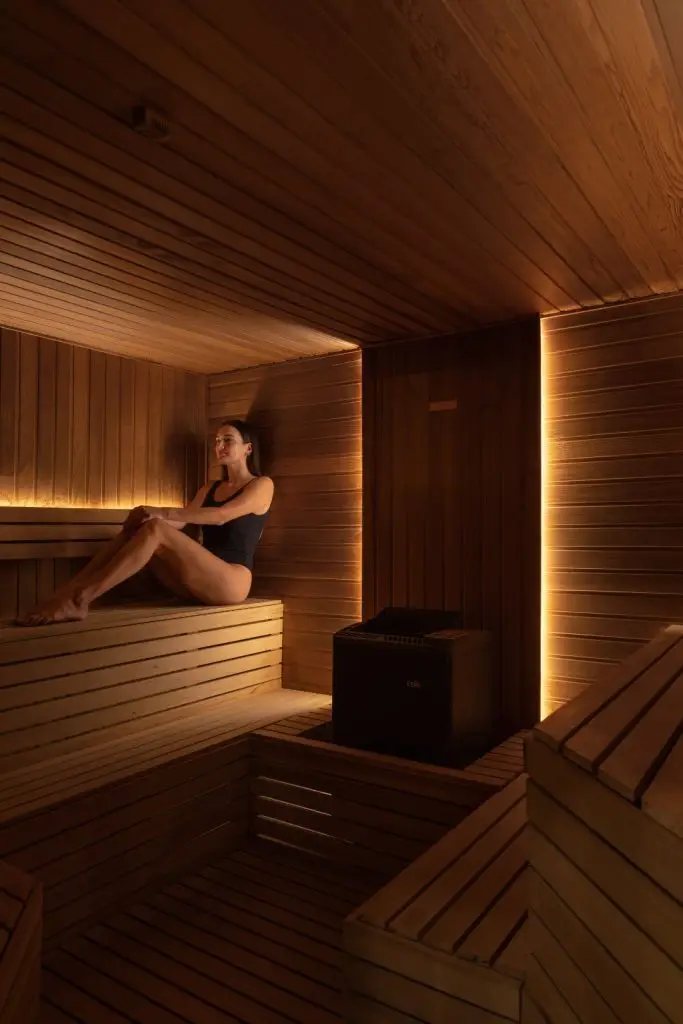 Timber sauna with warm ambient lighting at DIP Bath House